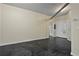 Living room featuring concrete floors, neutral walls, and a view of the bathroom and storage units at 800 Peachtree Ne St # 8508, Atlanta, GA 30308