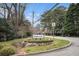 Entrance to Hampton Glen neighborhood with lush landscaping and established trees at 1434 Hampton Glen Ct, Decatur, GA 30033