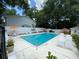 Sparkling in-ground pool with ample lounge seating and orange umbrellas at 1434 Hampton Glen Ct, Decatur, GA 30033