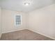Neutral bedroom with carpeted floors, a window, and ample natural light at 3005 Hidden Dr, Lawrenceville, GA 30044