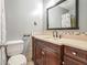 Updated bathroom with dark wood vanity and modern fixtures at 1495 Harbour Oaks Rd, Tucker, GA 30084