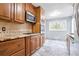 Bright kitchen with stainless steel appliances and granite counters at 1495 Harbour Oaks Rd, Tucker, GA 30084