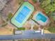 Aerial view of tennis court, pool, clubhouse, and parking lot at 2710 Cumberland Se Ct # 2710, Smyrna, GA 30080