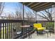 Relaxing balcony featuring outdoor furniture and a view of trees at 2710 Cumberland Se Ct # 2710, Smyrna, GA 30080