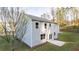 Exterior home view featuring a well-maintained backyard, a concrete patio, and lush greenery with multiple levels at 4098 Fairlady Ct, Kennesaw, GA 30144