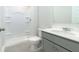 Clean and modern bathroom with a shower, white toilet, gray vanity, and white countertop at 4098 Fairlady Ct, Kennesaw, GA 30144