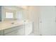 Bathroom featuring double sinks, lots of light, and large mirror at 4098 Fairlady Ct, Kennesaw, GA 30144