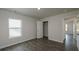 A simple bedroom with dark floors and a large window at 4098 Fairlady Ct, Kennesaw, GA 30144