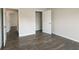 A bedroom boasts dark floors, neutral walls, and an open closet space at 4098 Fairlady Ct, Kennesaw, GA 30144