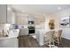 Modern kitchen with gray cabinets, stainless steel appliances, white countertops, and a large kitchen island at 4098 Fairlady Ct, Kennesaw, GA 30144