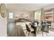 Inviting living room and dining area featuring modern decor, a neutral color palette, and plenty of natural light at 4098 Fairlady Ct, Kennesaw, GA 30144