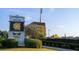 View of the Fifth Third Bank Stadium signage with the school logo surrounded by green shrubs in a well kept yard at 4098 Fairlady Ct, Kennesaw, GA 30144