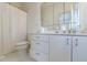 Bathroom featuring a toilet and vanity with plenty of storage space and a shower with a white curtain at 400 Laurel Chase Ct, Atlanta, GA 30327