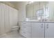 Bathroom featuring a toilet and vanity with plenty of storage space and a shower with a white curtain at 400 Laurel Chase Ct, Atlanta, GA 30327