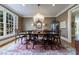 Formal dining room featuring a chandelier, hardwood floors and large windows at 400 Laurel Chase Ct, Atlanta, GA 30327