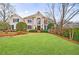 Charming two-story traditional home featuring manicured lawn and a welcoming front entrance at 400 Laurel Chase Ct, Atlanta, GA 30327