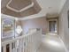 Upstairs hallway showcasing elegant chandelier and large arched window for lots of natural light at 400 Laurel Chase Ct, Atlanta, GA 30327