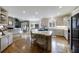 Bright kitchen with island and breakfast bar, modern appliances, and an open layout into the living space at 400 Laurel Chase Ct, Atlanta, GA 30327