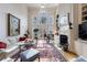 Spacious living room boasting a fireplace, built-ins, and plenty of natural light at 400 Laurel Chase Ct, Atlanta, GA 30327