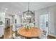 Bright and airy breakfast nook with modern light fixture in view of a modern kitchen at 1035 Hembree Grove Dr, Roswell, GA 30076