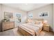 Serene bedroom with neutral decor, natural light, and cozy furnishings at 144 Cadence Trl, Canton, GA 30115