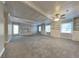 Spacious living room featuring a fireplace, built-in shelving and plush carpet at 2382 Smokehouse Path, Lawrenceville, GA 30044