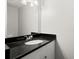Clean bathroom with a granite countertop, ample lighting and fixtures at 265 Winding River Dr # F, Atlanta, GA 30350