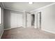 Bedroom featuring neutral walls, carpet, and closet at 265 Winding River Dr # F, Atlanta, GA 30350