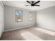 Bright bedroom features natural lighting and neutral carpet at 265 Winding River Dr # F, Atlanta, GA 30350