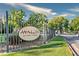 Community entrance sign for Avalon at Sandy Springs with manicured landscaping and gated access at 265 Winding River Dr # F, Atlanta, GA 30350