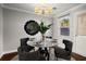 Elegant dining room with a marble table, stylish chairs, and a modern chandelier, ideal for gatherings at 265 Winding River Dr # F, Atlanta, GA 30350