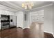 Modern kitchen with stainless steel appliances, white cabinets, and an adjoining dining area, perfect for entertaining at 265 Winding River Dr # F, Atlanta, GA 30350