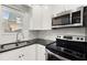 Bright kitchen with stainless steel appliances, sleek countertops, and white subway tile, perfect for cooking and baking at 265 Winding River Dr # F, Atlanta, GA 30350