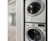 Convenient in-unit laundry closet with stacked washer and dryer near the bedrooms at 265 Winding River Dr # F, Atlanta, GA 30350