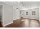 Open living room features hardwood floors, natural light, and neutral walls at 265 Winding River Dr # F, Atlanta, GA 30350