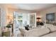 Comfortable living room featuring neutral decor, French doors leading to the sunroom, and decorative accents at 13 Little Silver Se Ct, Smyrna, GA 30080