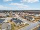 Aerial view of a neighborhood with beautiful homes and tree lined streets at 15 Streamside Dr, Covington, GA 30016