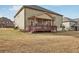 Exterior view of house with covered porch and yard at 15 Streamside Dr, Covington, GA 30016