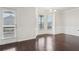 Open dining area with hardwood floors, wainscoting, access to the outdoor patio at 15 Streamside Dr, Covington, GA 30016