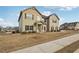 Two-story home features a manicured lawn, complementing the beige siding and black shutters at 15 Streamside Dr, Covington, GA 30016