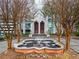 Striking building exterior featuring a water fountain, mature trees, and a grand entrance at 2870 Pharr Nw Ct # 2008, Atlanta, GA 30305