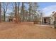 Expansive backyard with a deck and storage shed at 4648 Seward Rd, Powder Springs, GA 30127