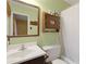 Bathroom with white walls, white shower curtain, and a heart-shaped medicine cabinet at 4648 Seward Rd, Powder Springs, GA 30127