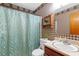 Bathroom with blue shower curtain and plaid wallpaper at 4648 Seward Rd, Powder Springs, GA 30127