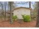 Wooden storage shed nestled in a wooded backyard at 4648 Seward Rd, Powder Springs, GA 30127