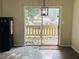 Dining area with sliding glass doors leading to an outdoor deck at 120 Mossy Brook Dr, Stockbridge, GA 30281