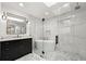 Beautiful bathroom with modern tub, glass shower, marble floors and dark cabinets at 1558 Grant Ne Dr, Atlanta, GA 30319