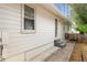 Exterior view shows the basement entry, siding and gray steps to the back door at 1558 Grant Ne Dr, Atlanta, GA 30319