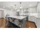 Bright kitchen with a large island, stainless steel appliances, and a tile backsplash at 1558 Grant Ne Dr, Atlanta, GA 30319