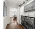 Well-organized laundry room with modern appliances and a sliding barn door at 1558 Grant Ne Dr, Atlanta, GA 30319